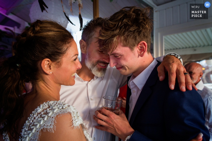 bride and groom with son happy teardrop Zandvoort Safarilodge, wedding venue photo of bride and groom with son happy teardrop