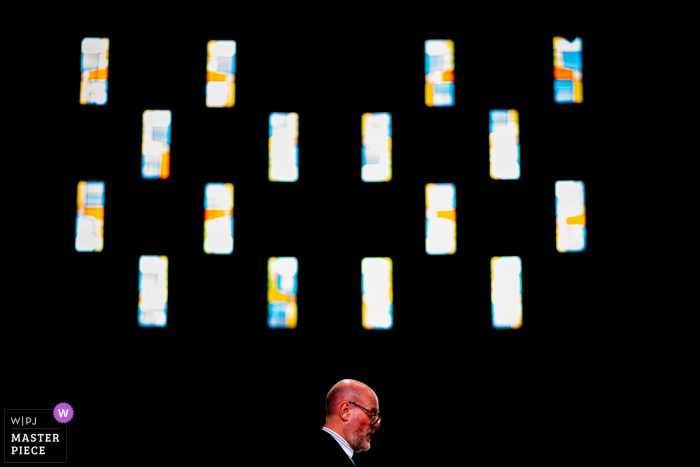 A guest gives a reading at the church ceremony St Thomas More Church, Coventry Wedding Photos | A guest gives a reading.