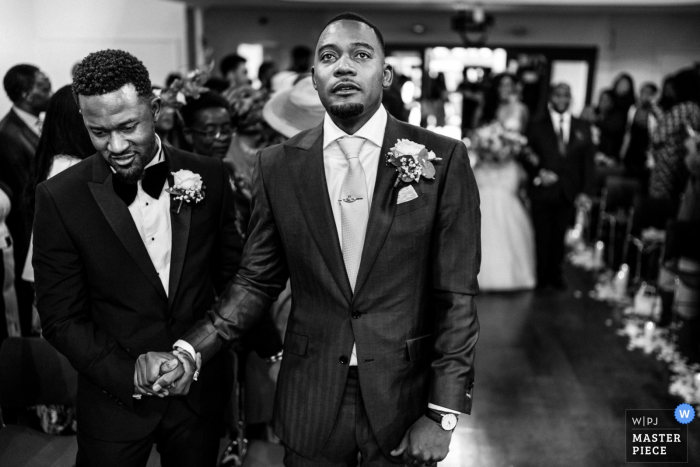 Photo by: <a href="https://www.wpja.com/contests/2019-v20/best-wedding-photographers/2576744">Paul Rogers - Hitchin Hertfordshire</a> Kensington Temple, London wedding ceremony photo | The Groom and Best Man as the Bride approaches