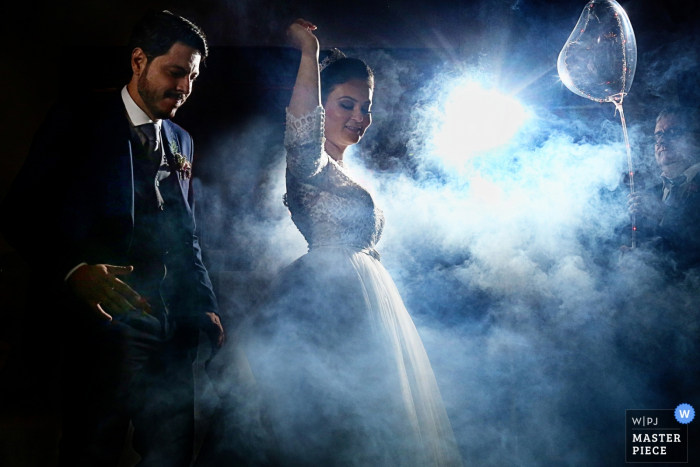 Goiás Brazil wedding reception photo from the foggy dance floor with bride and groom