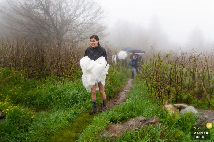 Black Balsam Knob, NC Wedding picture showing the Bride exiting the ceremony on a mountain trail Black Balsam Knob, NC Wedding | Bride exits ceremony on mountain trail