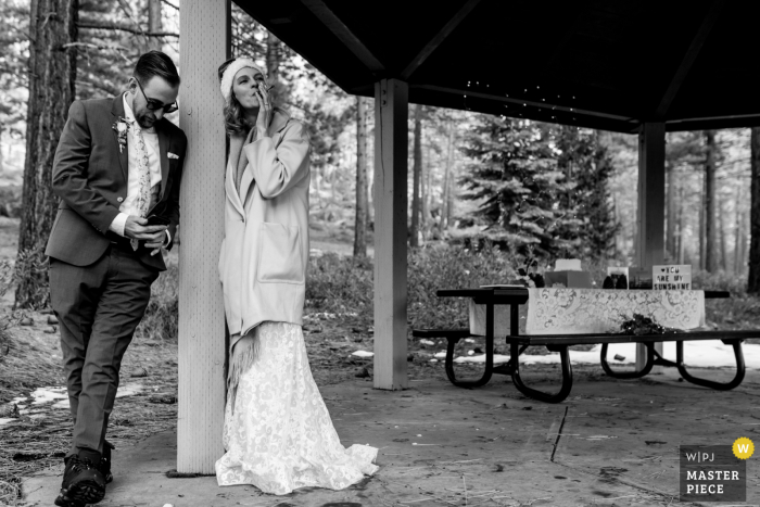 Zephyr Cove, NV wedding elopement image of a bride and groom taking a break from activity and share a quiet moment together during their elopement