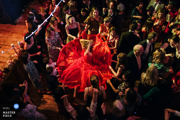 Wilton's Music Hall, London Wedding picture of the Bride spinning around on the dance floor Wilton's Music Hall, London Wedding Photography | Bride spinning around on the dance floor