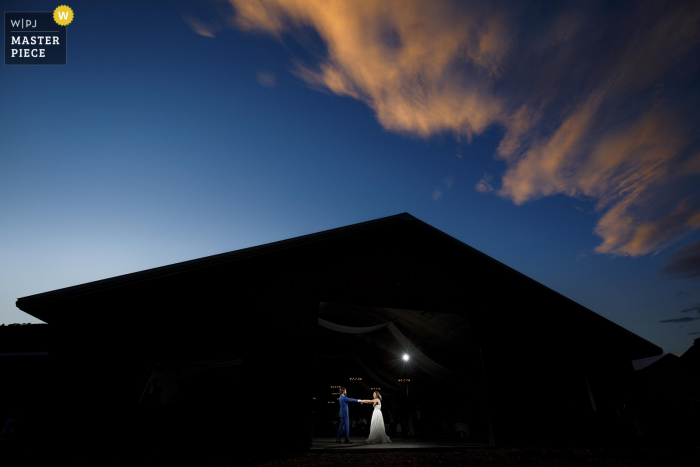 The newlyweds share their first dance during sunset at 4 Eagle Ranch