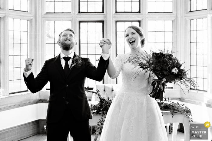 UK wedding photography from the England Coombe Lodge showing Pure joy after announcing the couple husband and wife UK wedding photography from the England Coombe Lodge showing Pure joy after announcing the couple husband and wife