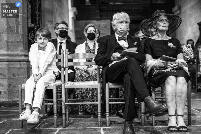 wedding photo from a ceremony in France Quimper of guests waiting Too long with covid 19 masks on