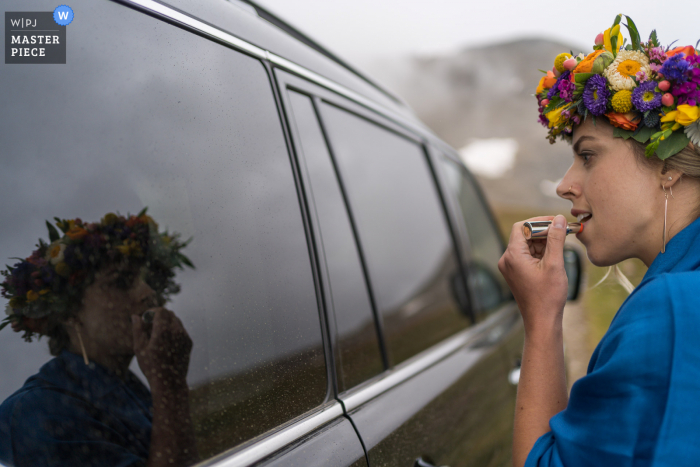 Photo of bride doing finishing touches before ceremony in Breckenridge, Colorado Photo of bride doing finishing touches before ceremony in Breckenridge, Colorado