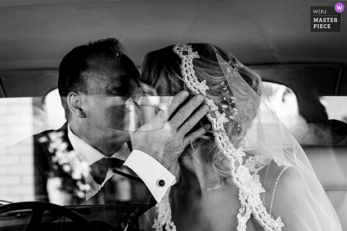 Italy father of the bride kisses her before entering in the church at San pietro in montorio Rome 