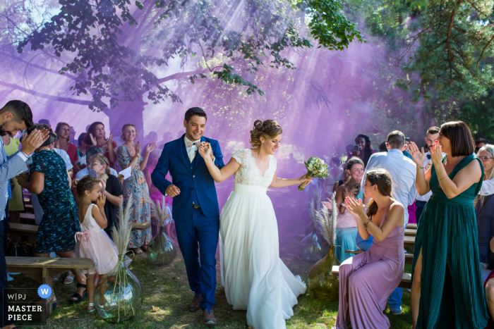 Auvergne-Rhône-Alpes Ceremony photography with amazing purple smoke outdoors