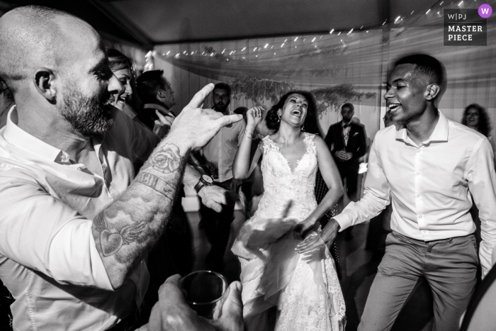 The bride has a blast on the dance floor with the guests at the Reception venue Domaine des Moures		