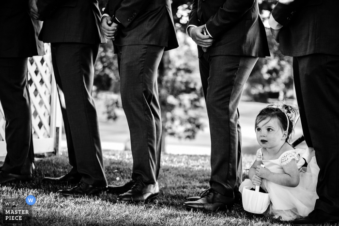 Image of the flower girl at the ceremony at cog hill country club