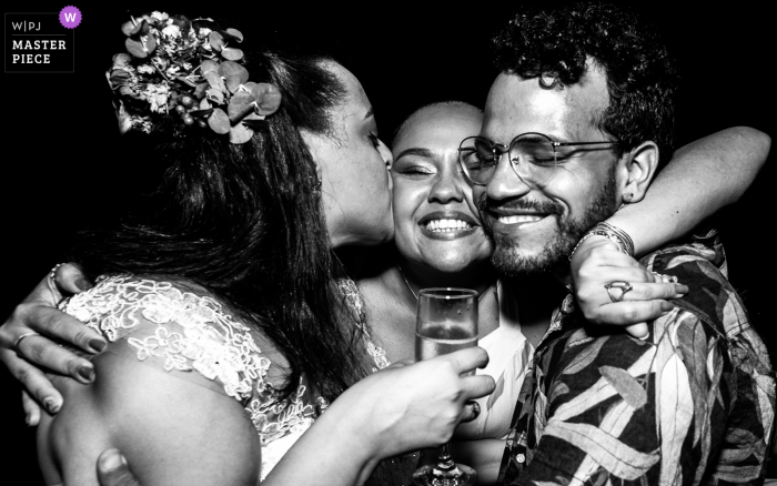 Alagoas wedding photo from a Brazil Reception showing love in a friends hug