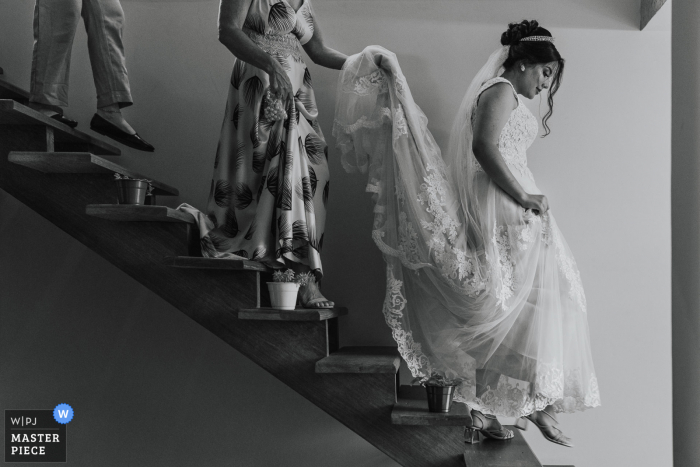 Minas Gerais wedding photo from Brazil during the Making of the Bride walking down the stairs Minas Gerais wedding photo from Brazil during the Making of the Bride walking down the stairs