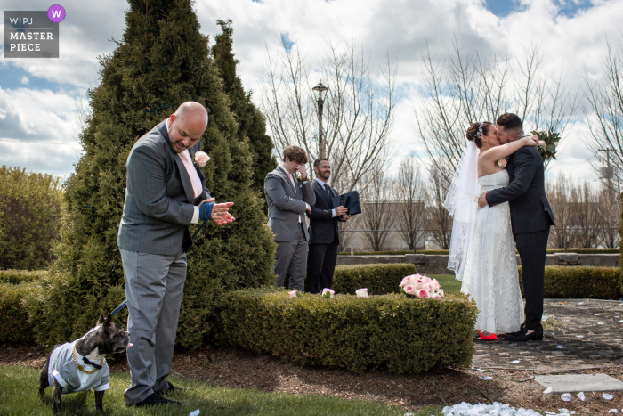 The Hacienda Sierra, Kitchener, Ontario wedding ceremony kiss between the bride and groom