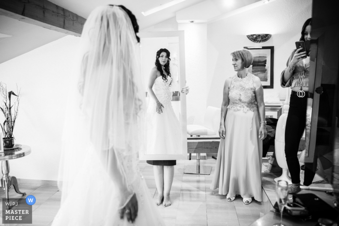 Bride getting ready in her hotel room in Switzerland