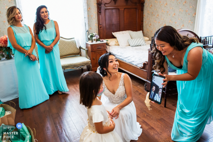 Elliston Vineyards at Sunol wedding image of the bride and helpers saying hi to grandparents who could not attend the wedding in person