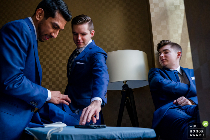 Wedding image from Belvedere, Baltimore MD of The groomsmen ironing their wedding attire