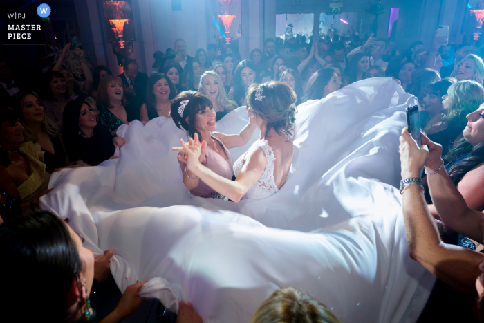 Photo by: <a href="https://www.wpja.com/contests/2020-v04/best-wedding-photographers/2602242">David Pullum - Exeter Devon</a> Israeli Dancing with the bride and mother of the bride at the Grosvenor House Hotel reception party