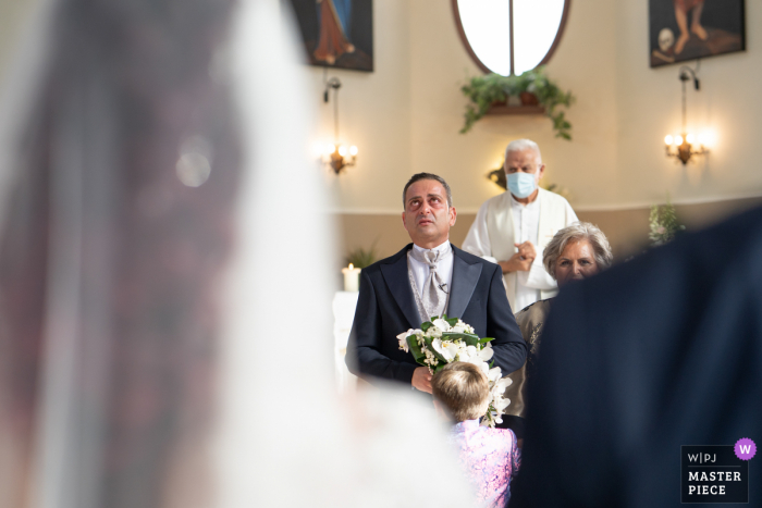 Church of Cassibile wedding image of the bride arriving to the ceremony with her new husband watching her walk in