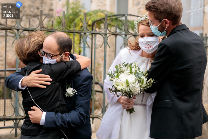 Photo by: <a href="https://www.wpja.com/contests/2020-v04/best-wedding-photographers/2602726">Ludovic Lieffrig - Saint-Mathieu-de-Tréviers </a> Mairie de Nîmes wedding photo of family giving hugs to one another after the marriage in South France