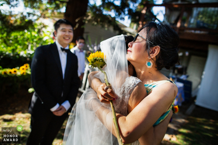 California outdoor ceremony wedding photography from Oakland showing it's Hard for Mom to let go of the bride