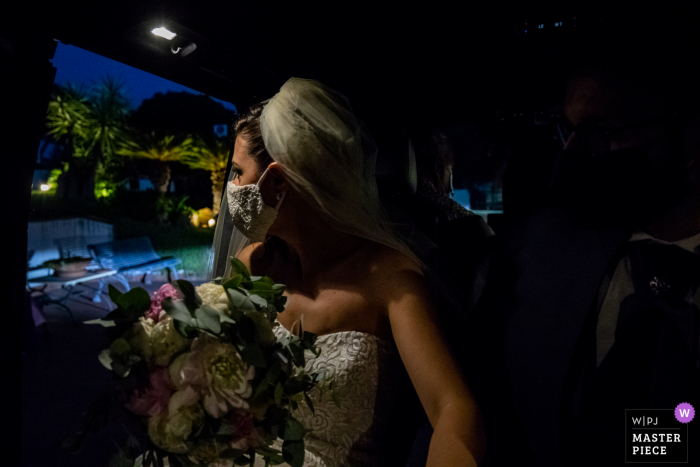 A Catania wedding photographer captured this Grand Hotel Baia Verde - Aci Castello bride looking out, and tries to figure out what her wedding will look like with the anticovid measures