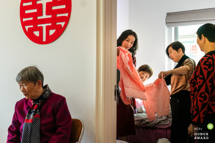 Chinese family home wedding photo of the bride getting ready for the ceremony Chinese family home wedding photo of the bride getting ready for the ceremony