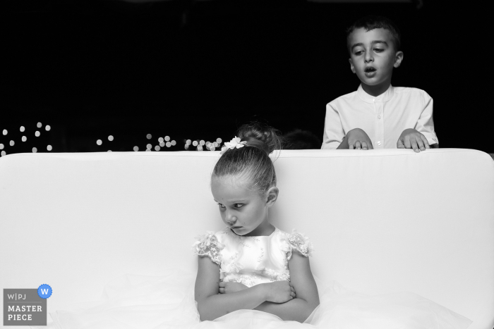 Arezzo wedding photo from the Reception Venue, Il casale del Marchese of a Little bridesmaids was angry with her brother