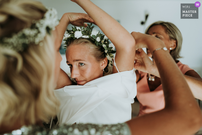 France wedding photo from an Ile de Ré, family home of the bride puts on her dress