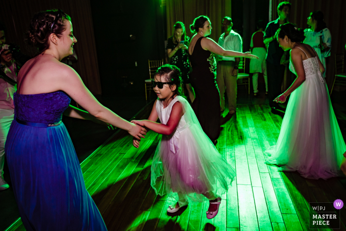 Wedding photography from Vietnam - little girl dancing at reception