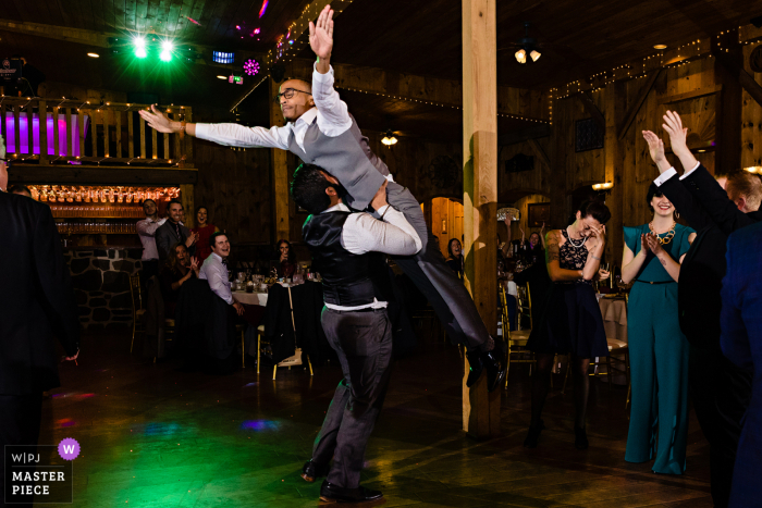 Wedding photograph from Philadelphia, Pennsylvania - Getting into the wedding reception with a classic Dirty Dancing lift 