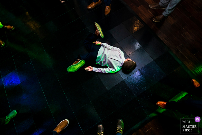 Pinery at the Hill, Colorado Springs, CO wedding photography of a kid break dancing during reception