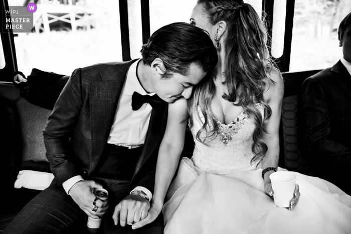 Estes Park, CO wedding photography during a moment between bride and groom in limo Estes Park, CO wedding photography during a moment between bride and groom in limo