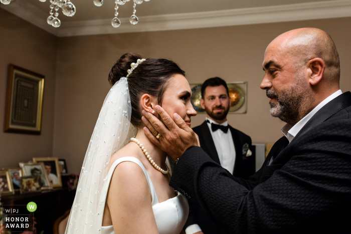 Istanbul wedding photography from Turkey showing the uncle of the bride is giving advices instead of her father because the father has recently passed away