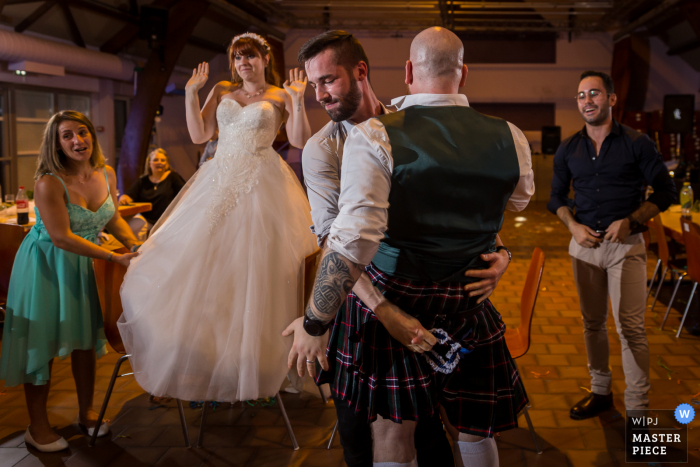 Bas-Rhin Reception wedding photography of the kilt game at the party