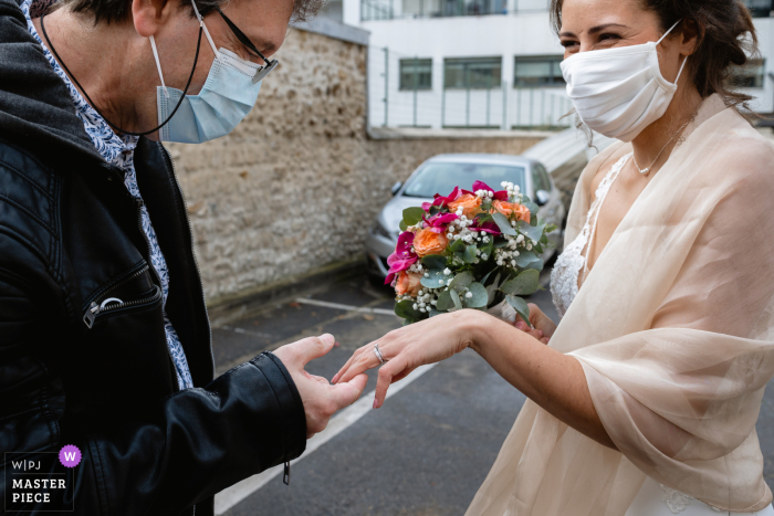 Île-de-France Ceremony wedding photography of the Bride's dad looking at her ring