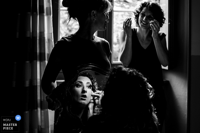 A top France wedding photographer in Ardeche captured this picture of the brides preparations in BW