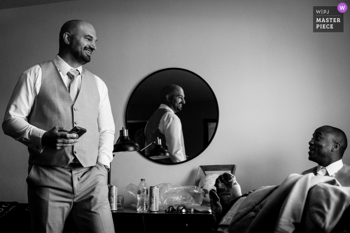 A top Montana wedding photographer in Butte captured this picture of groomsmen preparing for the marriage ceremony