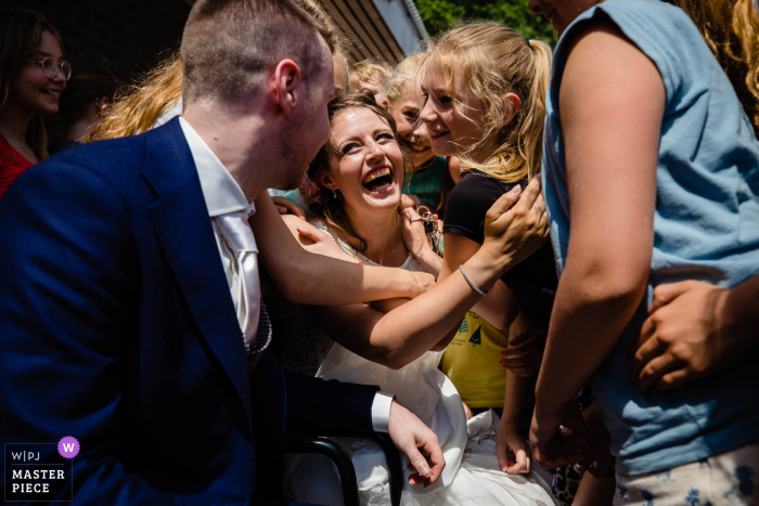 A wedding photographer in Noord Brabant created this image of congratulations hugs and embraces