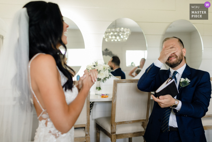 A wedding photographer in Chicago created this image of the  Officiant and Brides best friend seeing her for the first time 