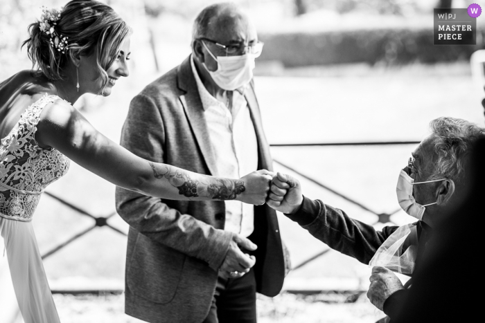 A top wedding photographer in Mairie captured this picture of a covid check A top wedding photographer in Mairie captured this picture of a covid check