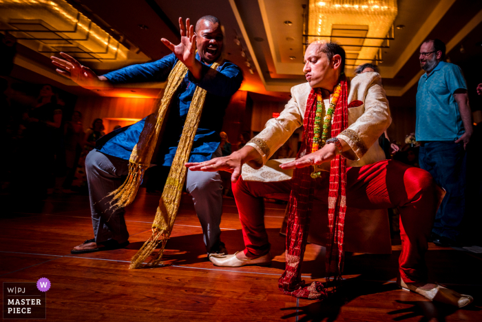 Best wedding photography from Marriott Metro Center in DC showing a pic of The groom and his best man dancing