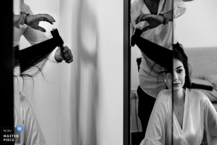 A top Istanbul wedding photographer at the Divan Hotel captured this picture of Bride is getting ready with her reflection on the mirror 