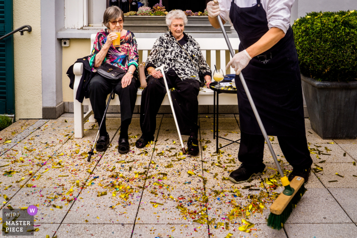 Frankfurt nuptial day award-winning image of Confetti mess and resting grandmas