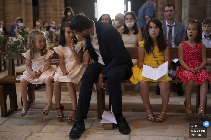 Tulle indoor marriage ceremony award-winning image showing Kids at church Tulle indoor marriage ceremony award-winning image showing Kids at church