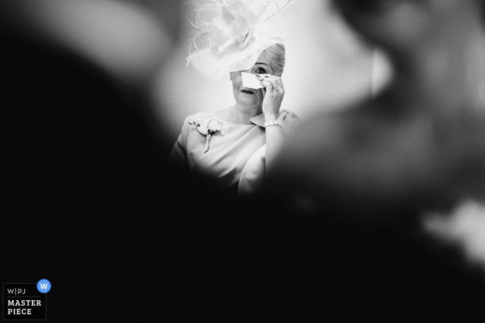 Photo by: <a href="https://www.wpja.com/contests/2021-v02/best-wedding-photographers/2632440">Andy Griffiths - St. Helens Lancashire</a> Delamere Manor nuptial day award-winning image of Brides mum crying as the bride sees her grandad