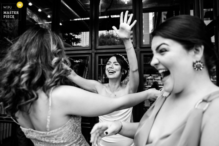 Photo by: <a href="https://www.wpja.com/contests/2021-v02/best-wedding-photographers/2634493">Nilufer Nalbantoglu - Kadıköy Istanbul</a> Istanbul marriage reception party award-winning photo at Markus Ribs Society that has recorded best friends forever hugs - from the world's best wedding photography competitions offered by the WPJA