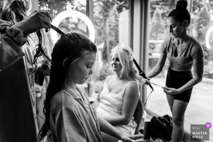 Philadelphia getting ready for marriage award-winning picture capturing The bride and her daughter getting their hair done simultaneously - from the world's best wedding photography competitions held by the WPJA