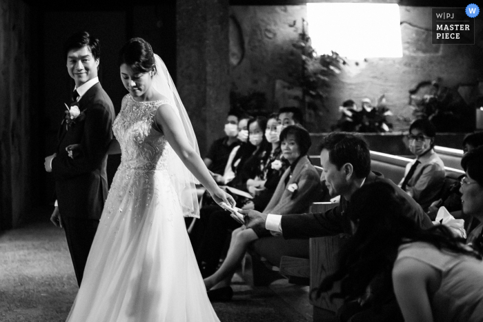 San Francisco nuptial day award-winning image of Brides dad quickly handing a handkerchief for her to wipe tears - from the world's best wedding photography competitions hosted by the WPJA