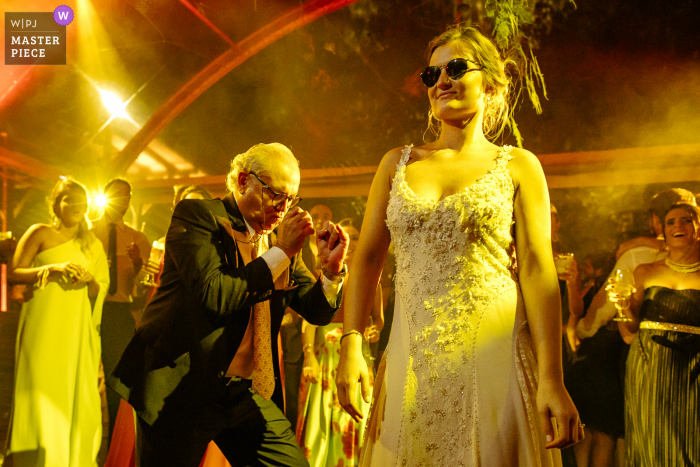 O Butiá - Porto Alegre marriage reception party award-winning photo that has recorded the Bride dancing in style with her uncle - from the world's best wedding photography competitions offered by the WPJA